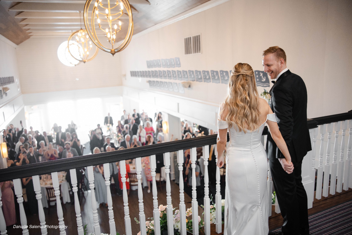 Wedding-reception-newlyweds-entering-celebration-WEDDING-&-EVENTS-Ballroom-Table-decor-Avalon-Yacht-