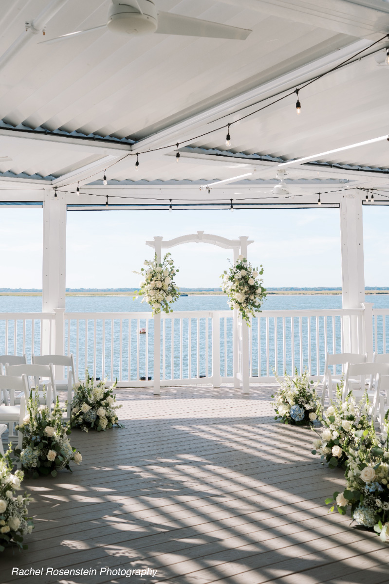 waterfront-wedding-arch-white-chairs-floral-decor-WEDDING-&-EVENTS-Ceremonies-Avalon-Yacht-Club