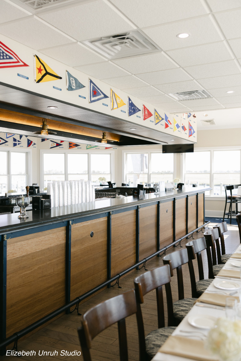 Nautical-themed-bar-interior-with-signal-flags-WEDDING-&-EVENTS-Bar-Avalon-Yacht-Club